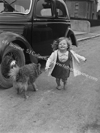 LITTLE GIRL WITH DOG